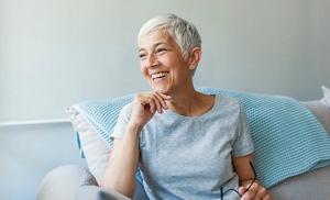 Smiling older woman with a cropped pixie cut
